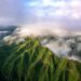 an aerial view of a green mountain range
