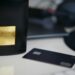 selective focus photography of black card on white table