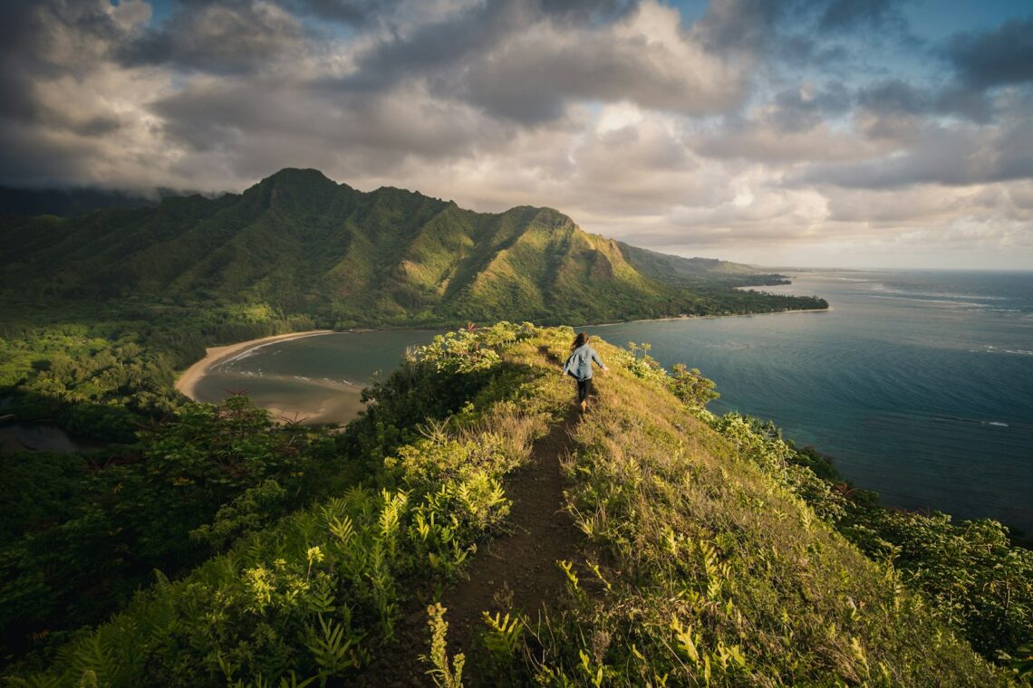 woman standing on hill in islet