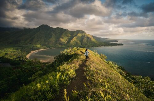 woman standing on hill in islet