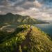 woman standing on hill in islet